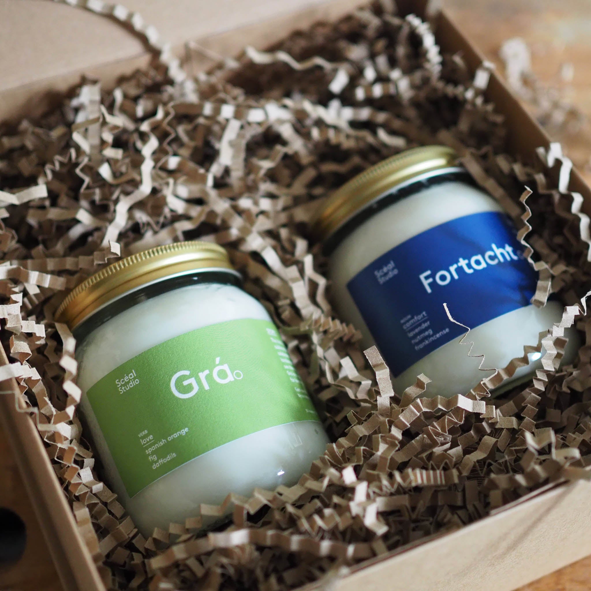 Two candles from thr sceal collection in a gift box