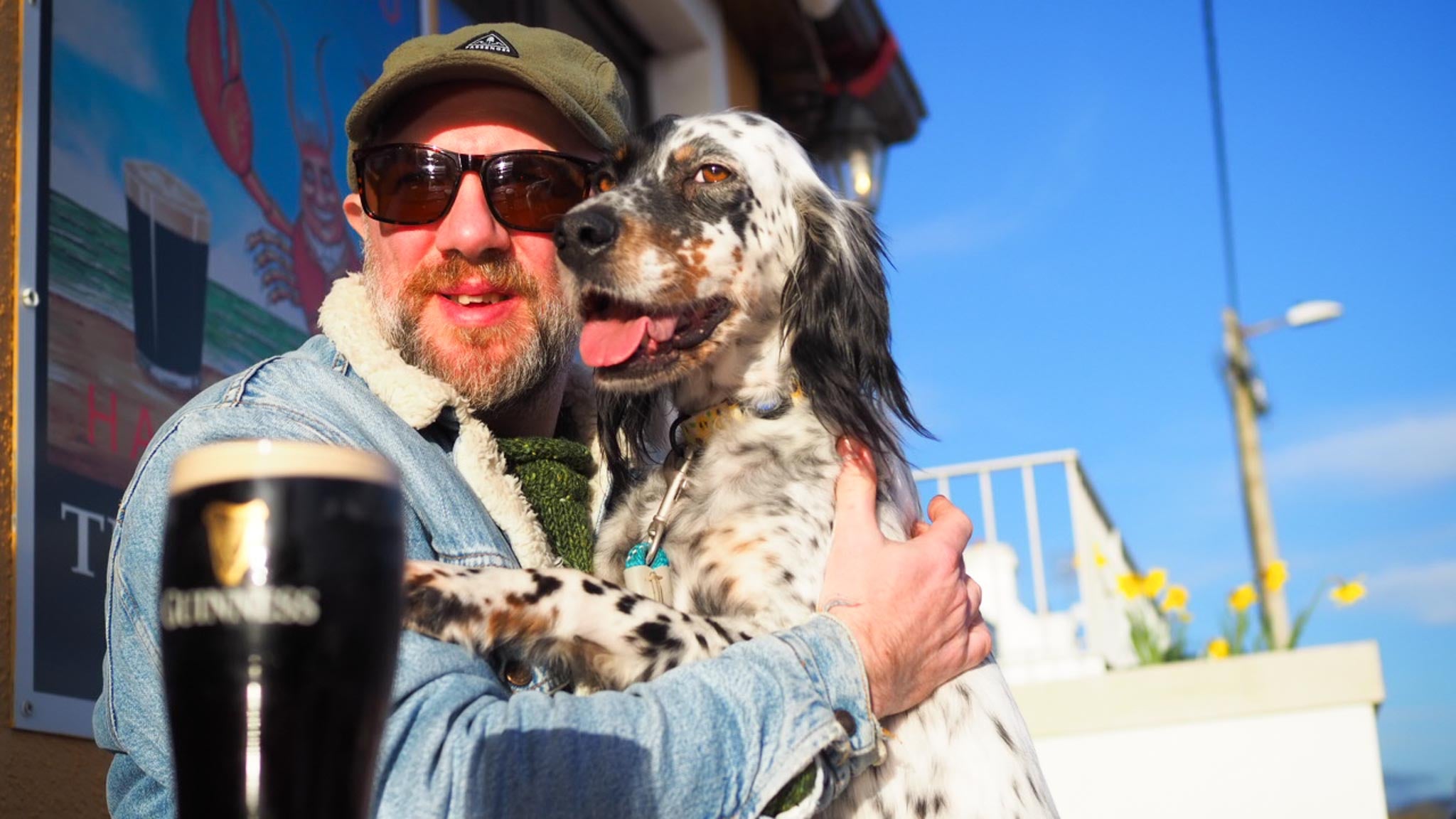 A photo of Bridie sitting on Michael outside a pub called Harrys in Rosses Point.