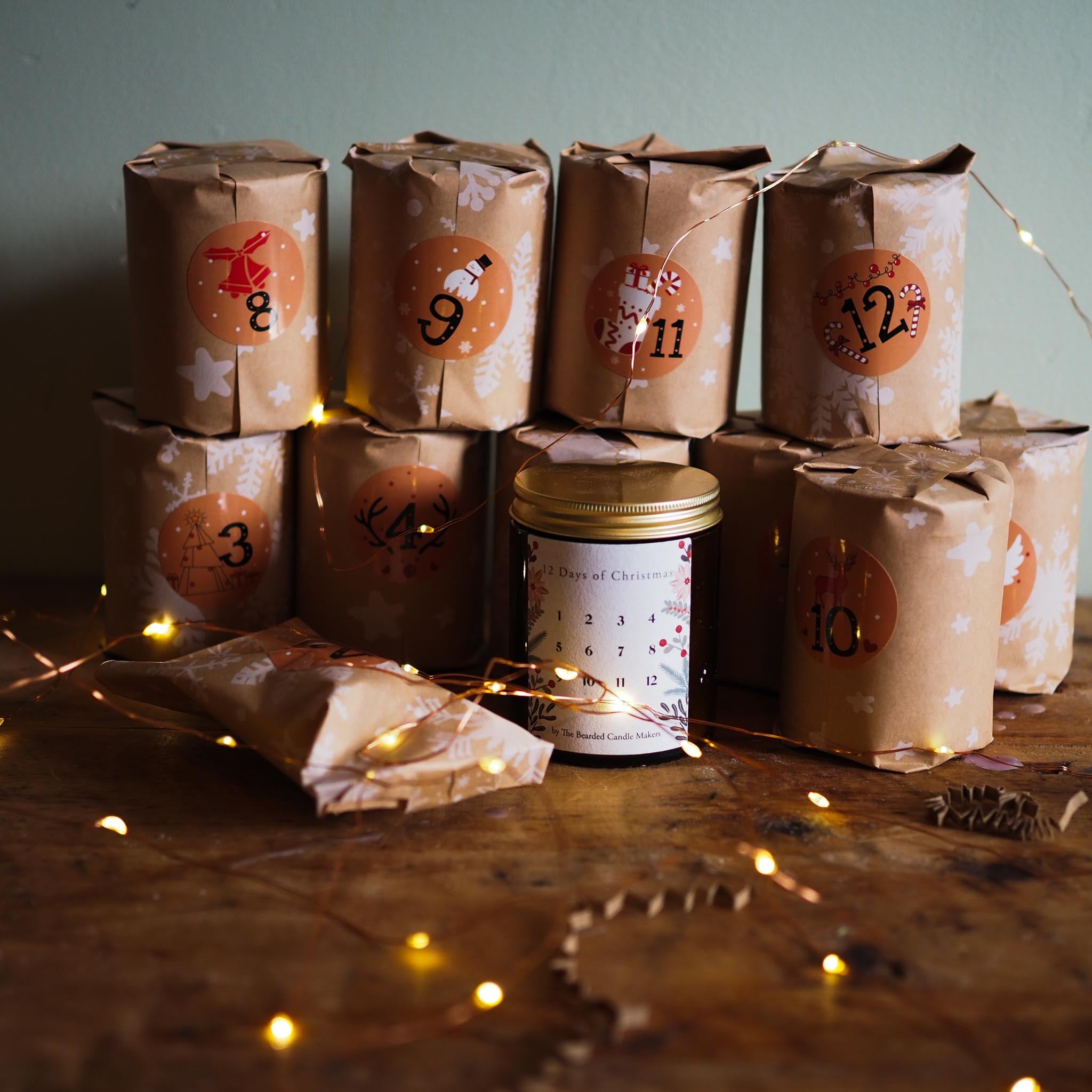 Luxury Irish candle advent calendar displayed open with numbered candles and festive paper wrapping