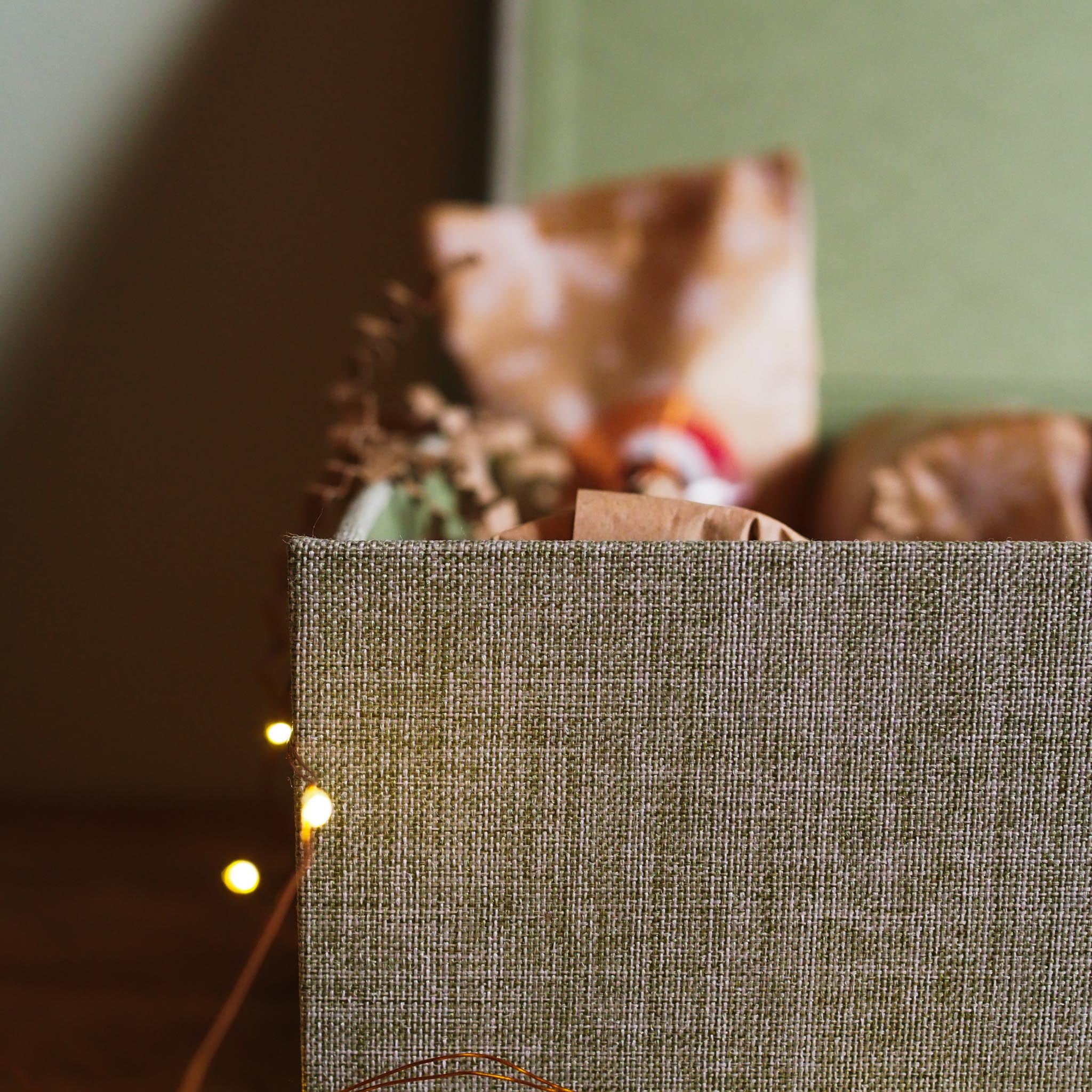 Textured brown box with decorative elements on a blurred background -  the gift box by the bearded candle makers
