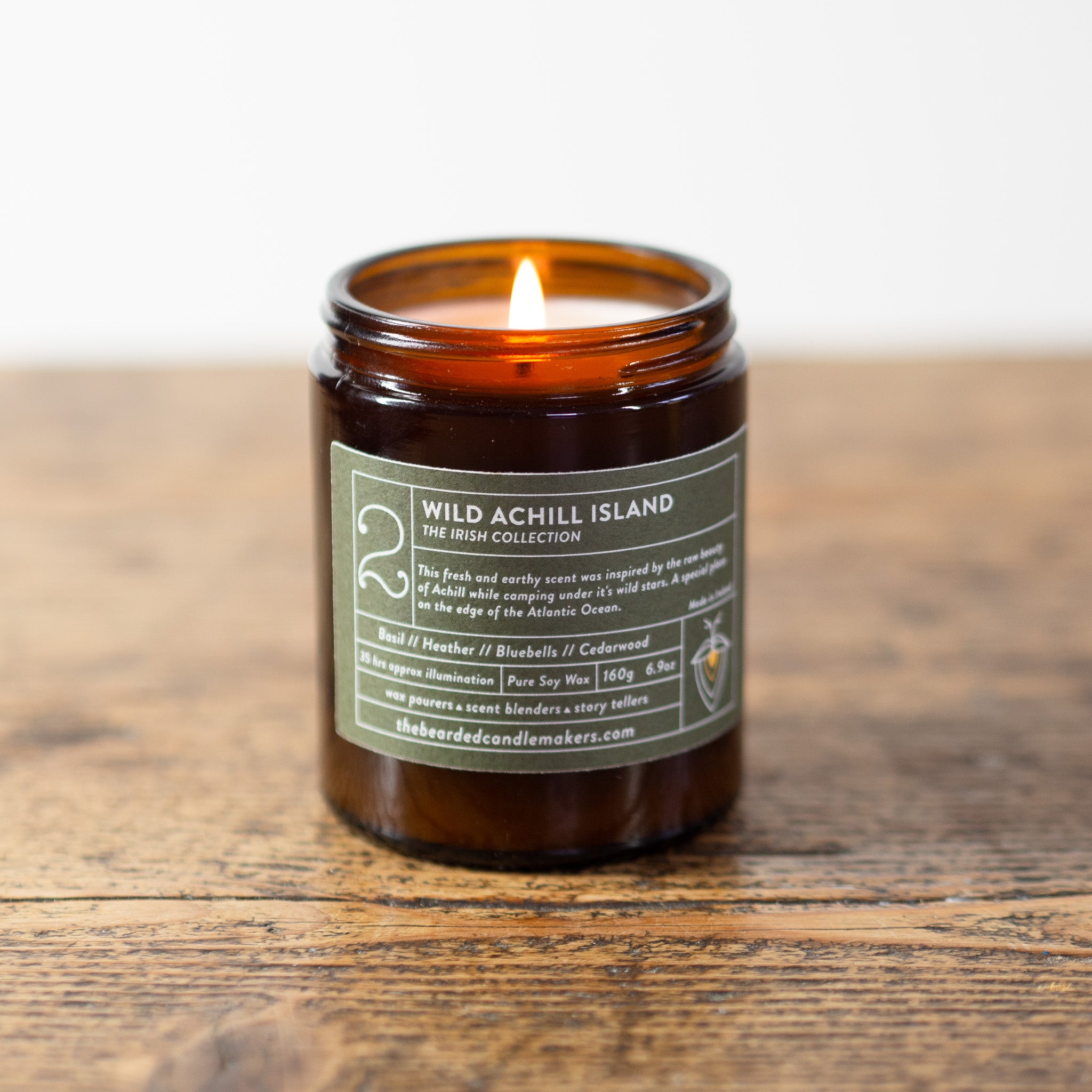 A photo of our Wild Achill Island soy candle on a wooden table.